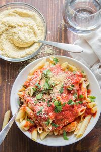 Do your next pasta night right, and whip up a batch of this homemade vegan Parmesan cheese. All you need are 5 ingredients and 5 minutes! You'd never guess this easy cashew-based cheese was dairy-free! #veganrecipes #vegancheese #dairyfree