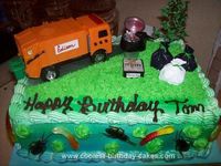 Homemade Garbage Truck Birthday Cake: I made this Garbage Truck Birthday Cake for a friend of mine who is a garbage man. I searched EVERYWHERE for an orange toy garbage truck because the town