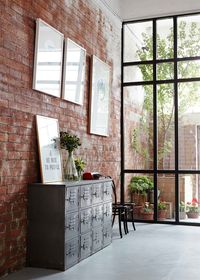 Industrial style interior with exposed brick wall. What captured my interest on this specific interior was the usage of the brick exposed wall uniting the outdoor and indoor environments thus creating the feel of a lager space.