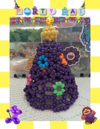 If something calls for a celebration, dress up with this cute kandi hat! Made with matte beads in a variety of colors, it'll make you the talk of the party. ;D The hat is 6&1/2 inches tall. It has about 1 foot of 1/4 inch elastic tied on intended to go under the chin.