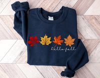 Welcome your favorite season, Fall, in this very cute Hello Fall autumn leaves sweatshirt.  Embrace sweater weather and a cup of hot cider in this sweater. This sweater is made from polyester and cotton. This combination helps designs come out looking fresh and beautiful.  The collar is ribbed knit, so it retains its shape even after washing.   Knit in one piece using tubular knit, it reduces fabric waste and makes the garment more attractive.  There are no itchy side seams on these sweaters.  .: 50% Cotton 50% Polyester .: Medium-heavy fabric 8.0 oz. .: Loose fit .: Sewn in label .: Runs true to size Care Instructions:  Machine wash: warm (max 40C or 105F); Non-chlorine: bleach as needed; Tumble dry: medium heat; Do not iron; Do not dryclean. Order Processing and Shipping Times: Once you