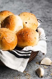 These Garlic Butter Dinner Rolls are soft, fluffy, and perfect for any occasion. Made from scratch, they are brushed with a delicious garlic butter sauce and baked to golden perfection. Perfect for Thanksgiving, Christmas, or a Sunday dinner, these garlic rolls are easy to make and irresistible. For an extra touch, sprinkle fresh parmesan cheese on top for Parmesan Garlic Rolls!