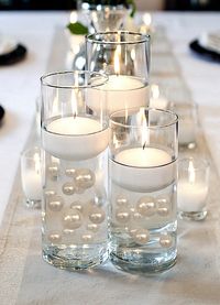 "Wow your guests with this fascinating trend. Elegant with a magical twist vase fillers and table scatters for wedding decorations, anniversaries, holidays, prom, birthdays, graduations, bridal showers and more Each Pack contains 50 Pearls: 4 jumbo (30 mm/1.25\"), 8 large (20 mm/0.75\"d), 18 medium (14 mm/0.5\"d), and 20 small (12mm/0.4\").  Fills 1 gallon of the floating Pearls for your vase decorations.  Option: 3 Submersible Fairy Lights in Warm White or White, (one Fairy Lights String per av