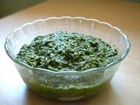 Classic, simple basil pesto recipe with fresh basil leaves, pine nuts, garlic, Romano or Parmesan cheese, extra virgin olive oil, and salt and pepper.