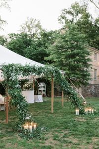 This winterthur wedding had a beautiful sailcloth tent with a greenery entrance perfect for those who are looking for a candelit reception! Check out the entire gallery for more.