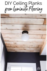 When we made over our Boys Bathroom, we needed to hide a bad ceiling repair, but our budget was low. Here's how we made DIY Ceiling Planks from Laminate Flooring.