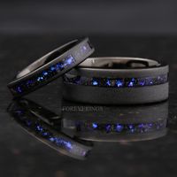 ►Material: Tungsten Carbide and Crushed Sandstone Inlay ►Color: Black Tungsten and Nebula Inspired Inlay ►Comfort Fit ►His Band Width: 8mm ►Her Band Width: 4mm ►Fit is true to size for Her band (4mm). ►Fit is slightly loose for His band (8mm), but should order as true to size. If you are between half sizes, recommend going down to the next closest half size for His band (8mm). ►This ring is inspired by the beautiful Orion nebula shown above. The color shifting blue-purple stones resemble gases o