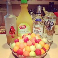 Drunken Melon Balls: Watermelon, Cantaloupe and Honeydew melon. Vodka, Pineapple Juice, Peach Schnapps. Use a melon ball scoop to fill your bowl with melon balls. Pour your liquor and juice over the balls and refrigerate.