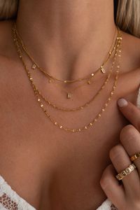 Details: 18K Gold plated Stainless Steel Water Resistant Sizing: Length of necklace: approx. 15.5 - 17.5 inches Adjustable length