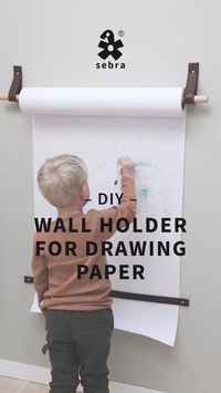 Upgrade your kids' art corner with this simple DIY drawing paper wall holder! This creative DIY looks great in any kids room and is also perfect for collaborative drawing sessions, making it a hit for playdates! Find step-by-step instructions in this video or at sebra-interior.com and unleash your drawing ideas!