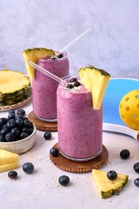 The Pineapple Coconut Blueberry Smoothie is a yummy tropical treat with coconut water to hydrate, and coconut milk and vanilla Greek yogurt for creamy flavor.