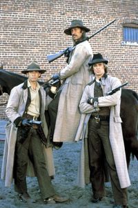 THE LONG RIDERS (1980) - Robert Carradine as 'Bob Younger' (left) & David Carradine on horseback as 'Cole Younger' - Keith Carradine as 'Jim Younger' (right) - Directed by Walter Hill ('Geronimo: An American Legend' - 'Wild Bill') - United Artists.