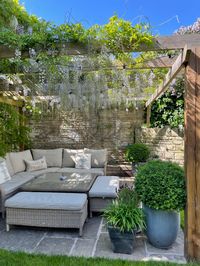 Corner of garden covered with DIY wooden pergola. 10 year old Wisteria trained to grow over one summer season, flowers flourished following summer. #wisteria #wisteriahysteria #pergola #gardenideas