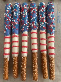 This listing is for A dozen (12) chocolate covered pretzel rods. Each pretzel is hand decorated with red, white and blue chocolate. Topped with sprinkles. They come individually wrapped in a clear bag and tied with red, white and blue ribbon. IN NOTES TO SELLER: - You MUST leave the date of your event - Ribbon color request if you prefer different then red, white and blue ribbon. Orders are shipped usps usually 2 day / 3 day delivery. All orders are non-refundable