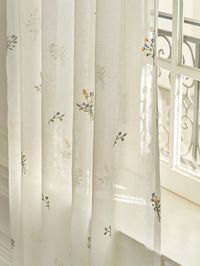 This Comfort Flower Embroidered Curtain is made of natural linen with flower embroidery. It is perfect to use to create a warming atmosphere in your space. It also lets enough sunlight come through, creating a cozy space for more comfort.  - Simple yet luxurious flower embroidered curtain- Natural linen material- Great to use in any season- Enough sunlight shines through *Prices vary by size*Curtain rod/rings/rails not included*Curtain strings and pins included