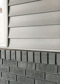 Grey exterior siding with dark grey stained brick Pinterest//tamielisabeth