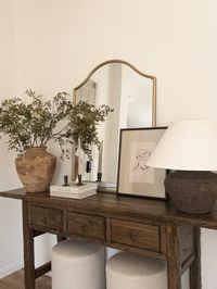 solid wood console table, mcgee & co, ottomans, lamp, large table lamp, candlesticks, vase, spring stems, frame, art print, etsy art, mirror, home finds, home decor styling, home decor deals   Follow my shop @accordingtomandy on the @shop.LTK app to shop this post and get my exclusive app-only content!  #liketkit #LTKHome #LTKStyleTip #LTKSeasonal @shop.ltk https://liketk.it/4JhOv