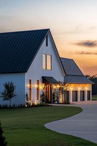 Full view of large white shouse barndominium with black roof one side has modern windows and doors the other side has large garage doors wall. Unlock the secrets of shouse barndominiums and find out how you can live where the wild west meets modern luxury.