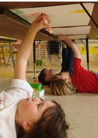 Under the table art/writing... Upper body strength and keeping them entertained with something new