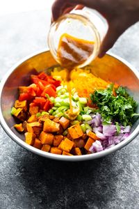 Wild rice and sweet potato salad is loaded with healthy veggies and tossed in a chili lime vinaigrette. Vegan and meal prep-friendly.