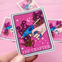 This crafter tarot card sticker is perfect for anyone needing a little beauty in their day!  About this product: 🌼Approximately 3 x 3 inches 🌼Water & UV Resistant 🌼Printed on high-quality gloss vinyl 🌼Ships in 1-5 business days via USPS ground 🌼Don't forget to clean the surface before applying the sticker About the "STICKER ONLY" OPTION: 🌼Includes the number of stickers you select 🌼Stickers are approximately 3x3 inches each 🌼All stickers are UV and water resistant 🌼Production time: 1-5