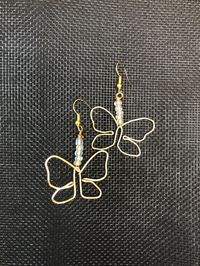 Style 2 of wire wrapped butterfly earrings with white/clear glass beads. About 2.5 inches long and available in gold and silver wire!