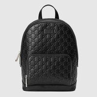 Shop the Gucci Signature leather backpack by Gucci. A classic backpack shape with a front zip pocket and multiple interior pockets. Made in heat debossed Gucci Signature leather with a defined print and firm texture.