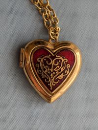 Vintage Gold Tone and Red Heart Shaped Locket Pendant from MMA Metropolitan Museum of Art 1984 Signed.  Good vintage condition.  I added the necklace chain as a free starter chain so it is ready to wear.