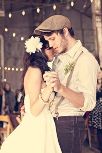 I like the grooms out fit and the big white flower in her hair! So romantic!!!!