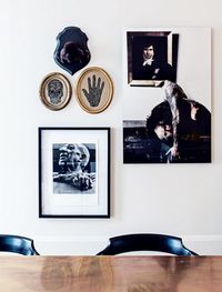 House tour: a modern French apartment within an opulent 19th-century shell: One of their favourite artworks is in the kitchen and dining area: a photograph of a shirtless, tattooed young man in a museum, making off with a classical portrait under his arm. “We love the confrontation between this modern, rock’n’roll guy and the traditional setting,” says Martin. “You wonder why he’s stealing something so contrary to his own style.” It’s an act of transgression that brings a hint of shadow to w...