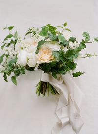 A completely neutral colored wedding with shades of ivory, gray, taupe, and beige anchoring the elegant design.