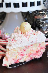 Peppermint Cheesecake. This holiday cheesecake is made with an Oreo cookie crust, filled with smooth peppermint cheesecake, and topped with light and airy peppermint frosting. #cheesecake #dessert #peppermint #frosting