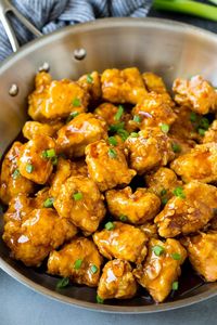 This honey chicken is crispy pieces of chicken breast that are fried to golden brown perfection, then tossed in a sweet and savory honey sauce.