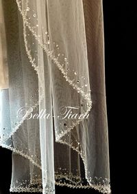 "New to our handmade Italian royal collection - Stunning, spectacular just Beautiful hard to describe how beautiful this veil is, my new favorite. handmade beaded edge veil with clusters of bugle beads, sequins, Swarovski crystals, tiny tiny pearls and flat Swarovski crystals just a must have Made to order please allow 10 business days to ship. CUSTOM cathedral veil 120\" + added ombre crystals at bottom. available in white, diamond white/off white, ivory and champagne PLEASE NOTE USPS STILL EXP