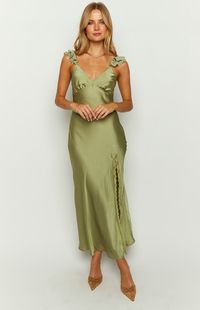 Sage Maxi Dress  How to style: Turn heads in this show stopping sage maxi dress ()! Perfect for your next formal event, simply pair with kitten heels (), gold jewellery and a shoulder bag () for an elevated look!   Features:      * Light weight material   * Maxi length    * V neckline   * Thin straps with ruffle detailing   * Non-stretchy    * Bias cut   * Invisible zipper (left side)   * Lace detailing   * Leg slit (left side)   * Adjustable straps