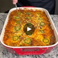 6.3M views · 39K reactions | Delicious Mexican Style Lasagna 🥵 | Delicious Mexican Style Lasagna 🥵 | By Brain Food | We're going to start by pouring
about a fourth of a cup of red enchilada sauce in the bottom
of our greased casserole dish. We're going to grab our little
silicone brush here and just brush that around. We're
going to grab four flour tortillas and just place them
on the bottom here overlapping. You can use corn if you like.
I'm just a big flour tortilla lover and we have one cut in
half. We're just going to place that right here to overlap.
Now, we're going to grab our taco meat mixture. This is two
pounds of ground beef with a little bit of garlic and
sauteed onions. We're going to add one can of Rotel right on
top. We're going to add one can of drained black beans on top