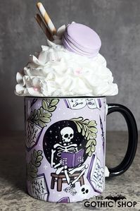 This spooky gothic Halloween mug is made from ceramic and features a sublimation print of skeletons reading, skulls and plants, on a lilac background.  High quality sublimation inks and mug are used for a longer lasting image. The mug has a black handle and inner.  Enjoy your favorite hot beverage in this Halloween mug.  It's a great addition to spookify your gothic decor and perfect for a Halloween party display. The mug is dishwasher safe, but as with all printed ceramic items, handwashing helps prolong colour. This 11oz mug holds 350ml to the brim, and is a perfect gift for ...