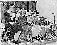 Mary Jane Truman, Margaret Truman, Bess Truman, and others watch a parade in Bolivar, Missouri. President Harry S. Truman dedicated a statue to Simon Bolivar in Bolivar., 07/04/1948