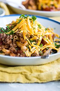 Easy goulash on white plates.