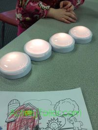 Use them to mark syllables by having students turn a light on for each syllable as they hear/say it. Break words down into individual sounds like, “b-a-t,” Then, I turn off a light and say “change the ‘b’ to a ‘k’.”  When they turn the light back on, they say the new sound and just tap gently on the lights/sounds that stay the same. Use a light to “turn on” the final consonant or cluster reduction.