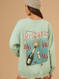 This humorous sweatshirt featuring the playful phrase "Prosec-ho-ho-ho" is perfect for spreading cheer and laughter at holiday gatherings, making it a fun staple for those who enjoy a good time and a glass of bubbly!