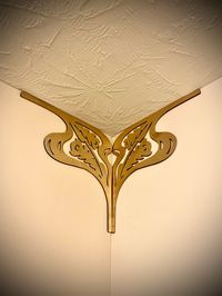 Totally change the look of an entire room by adding a set of these in each corner.  They can drastically change the feel of your living space. Art Nouveau decorative inside corner accent/trim corner decoration (set of 2) available in bright gold paint or 12 other finishes.  Set A. (see our many other corner accents in separate listings).  $21 for natural/unstained or $26 for stained.  You get a set of 2 (a left and a right), each measuring 10.5" high by 10.5" wide.  These are cut from 1/8" balti