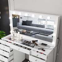 Step into the world of beauty and organization with the white makeup vanity desk with lights. This exquisite vanity offers an impressive 13 drawers, providing ample space to neatly arrange and effortlessly access all your beauty tools, cosmetics, and accessories. Illuminate your beauty routine with the 12 built-in lights of the vanity. Experience optimal lighting conditions that ensure precise and flawless makeup application. Say goodbye to shadows and hello to a radiant, well-lit face that will make heads turn. Immerse yourself in elegance with the white vanity featuring lights and an elegant glass top. The glass top not only adds a touch of sophistication to your beauty space but also offers a smooth and easy-to-clean surface, making maintenance a breeze. Discover the perfect fusion of f