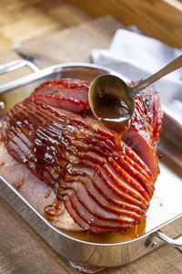 Brown Sugar Ham Glaze made from brown sugar, orange juice, honey, and spices is the PERFECT addition to a holiday ham and only takes 5 minutes to make! #ham #glaze #sauce #easter #christmas #holidays #thanksgiving #holiday #leftovers #dinnerthendessert