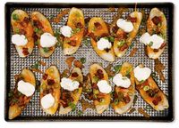 NYT Cooking: There’s no trick to these loaded potato skins, and making them is a breeze. Pile them high with toppings and broil until they look like something you may have eaten at an Irish bar in the bad part of town during college, the game playing on a big screen above the bathroom doors. That bar was pretty good, you know.