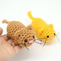 Crochet a cute, quick, and easy cat with this FREE amigurumi pattern! These cats are great for scrap yarn. Visit our site to make it now!