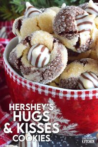 A deliciously decadent half vanilla and half chocolate cookie, coated in sugar, and topped with a chocolate kiss, Hershey’s Hugs and Kiss Cookies are a perfect holiday treat that everyone will love! These are quick and easy - no need to chill the cookie dough before baking either! Don't they look absolutely adorable!? #hershey #hugsandkisses #christmas #cookies