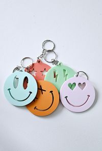 "These fun smiley face keychains are a great way to add some fun to your keys, back pack, gym bag, lunch kit, also make great party favors.  Keychain Details: - Laser cut from 1/8\" (3mm) acrylic - Two size options. 1.5\" or 2.5\" - keyring included Follow us on Instagram @ Meadesigncom SHIPMENT + DELIVERY Domestic (within Canada) shipping speeds are 5-7 business days. International (US) shipping speeds are 7-10 days. Please keep this in mind when you place your order."