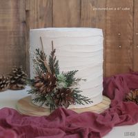 "Pine cone floral cake pick made with preserved evergreen cedar, dried flowers, little artificial succulents and grapevine sticks. Measures approximately 5\" tall x 4\" across Made on a cream felt base with a 4\" wooden pick to insert into the cake. Preserved/dried and artificial flowers A long-lasting keepsake Woodland Rustic style Matching topper: https://www.etsy.com/listing/1528931284 The set: https://www.etsy.com/listing/1529019078 Loose flowers: https://www.etsy.com/listing/726359800"