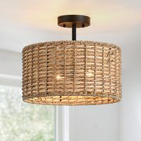 Nothing adds warmth and a casual inviting vibe like a natural woven semi-flush mount ceiling light. This flush mount is meticulously hand woven of natural rattan and seagrass in a drum silhouette. Inside, a 2-light cluster in matte black casts generous light and creates interesting shadow patterns on the walls of your entry, dining room or bedroom. This collection can work with a variety of decors, from boho, bohemian, coastal, eclectic, farmhouse to traditional styling, which is an ideal select